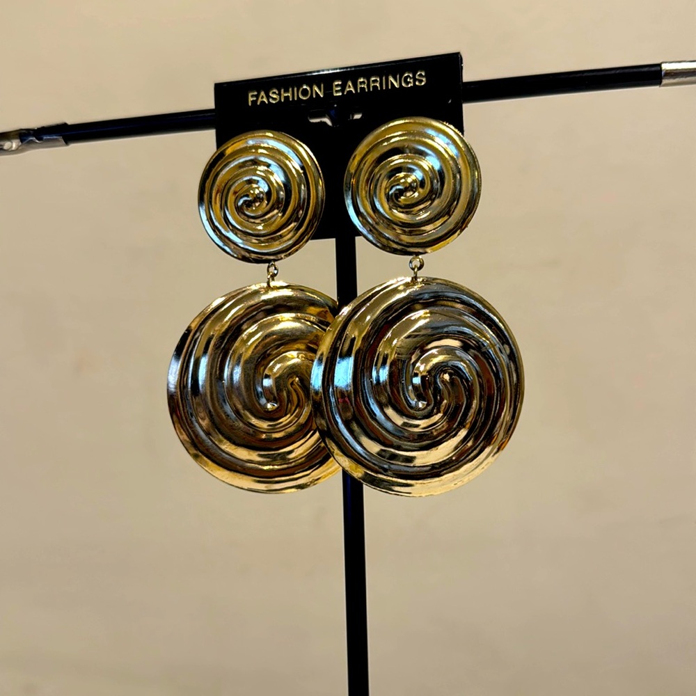 Gold tone circular dangle earrings with swirl designs pierced earrings
